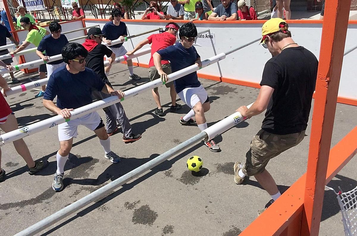 30 teams kick, slide in United Way human foosball tournament Local