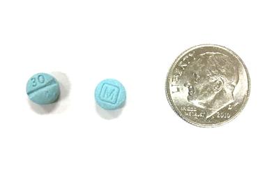 Counterfeit crossword clue