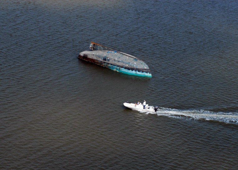 A capsized boat adrift in Galveston Bay