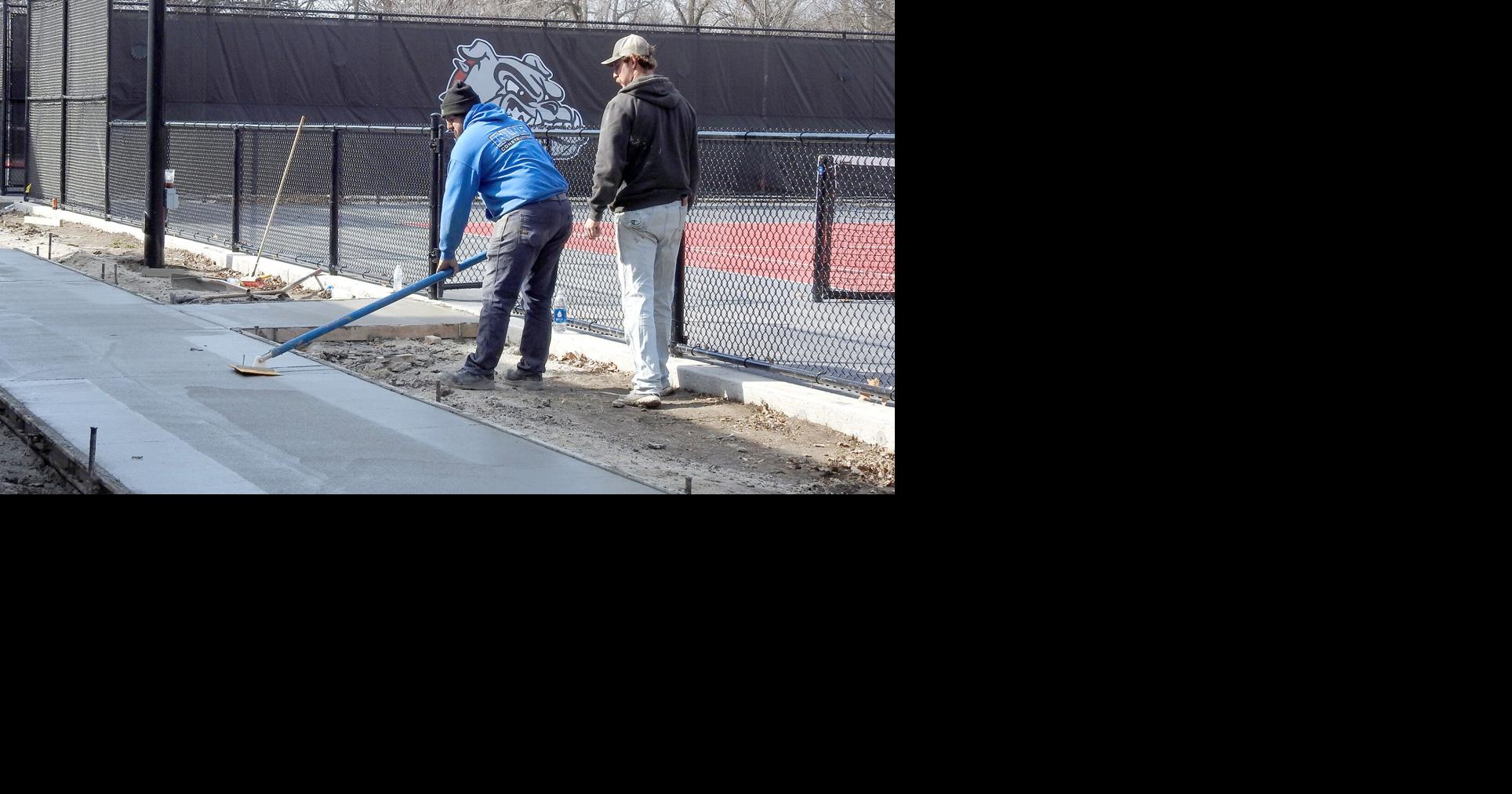 Concrete laid at tennis courts home season opens Monday Sports