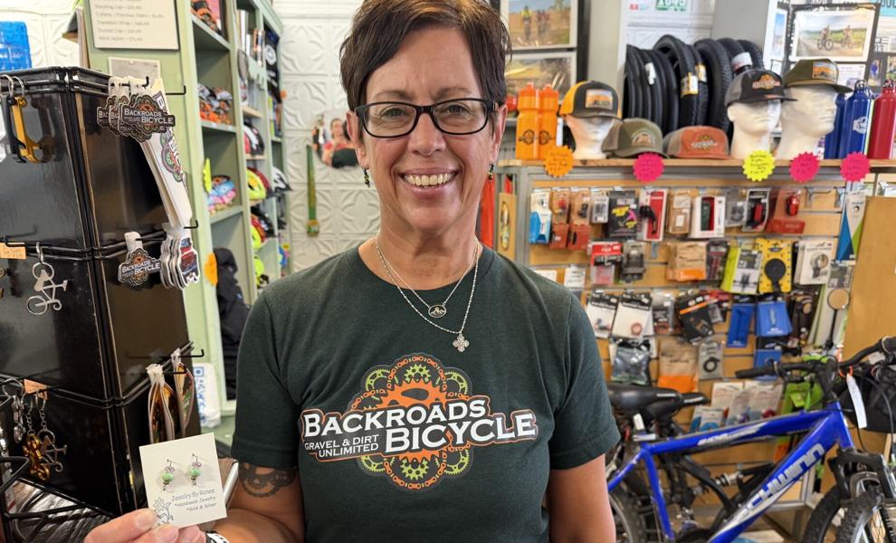 Earrings add artistic whimsy to bike shop