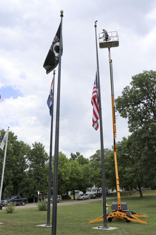 Host Lions replace flag pole topper