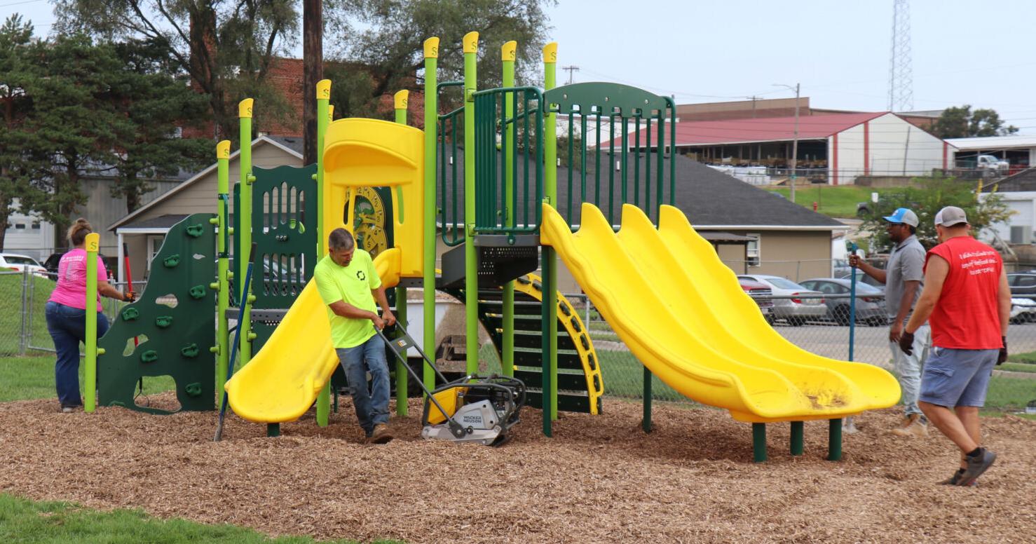 Kiewit provides mulch for Eugene Field playground, to donate money for lunches
