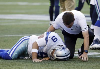 Cowboys Qb Tony Romo Is In A Back Brace But Jason Garrett Says He