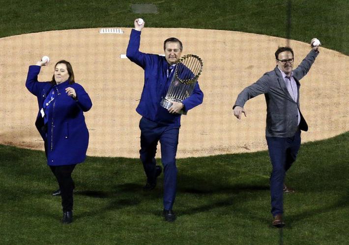 Chicago Cubs first baseman Anthony Rizzo, left, receives a Championship  Ring during a ring ceremony before a baseball game between the Chicago Cubs  and Los Angeles Dodgers at Wrigley Field on April