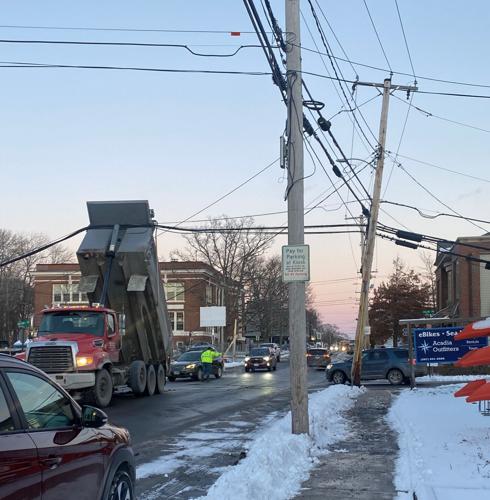 Dump truck tangles power lines | News | mdislander.com