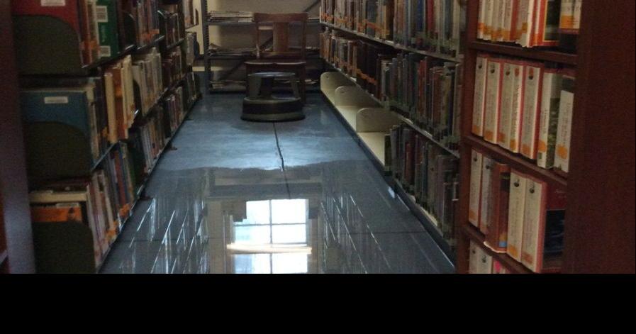Volunteers save collections as library floods a second time | News ...