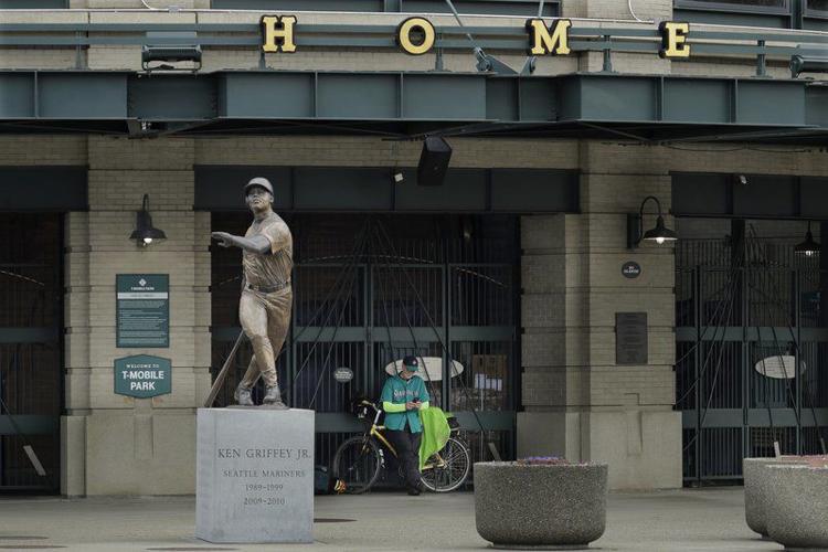 AP PHOTOS: MLB stadiums deserted as virus postpones opening day, National  Sports
