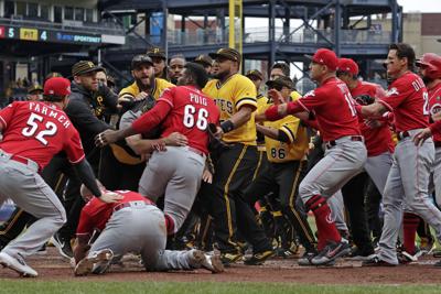 Photos: Reds, Pirates scuffle in the fourth inning on Sunday