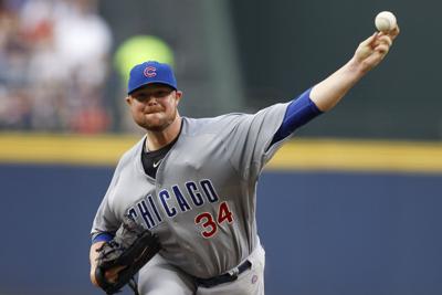 Cubs pitcher Jon Lester is still throwing his entire glove to