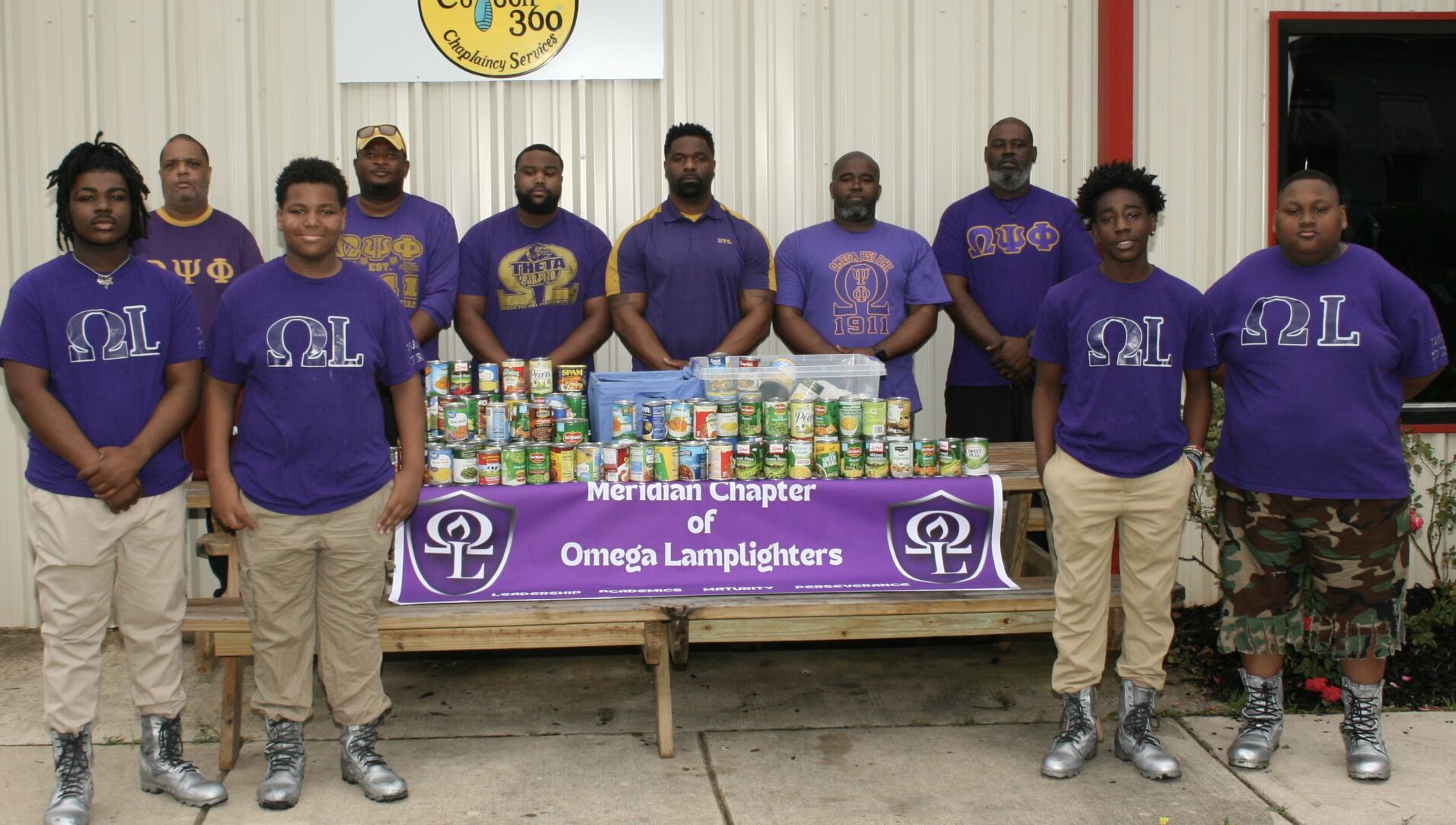 Omega Lamplighters collect food for Feed by Faith News