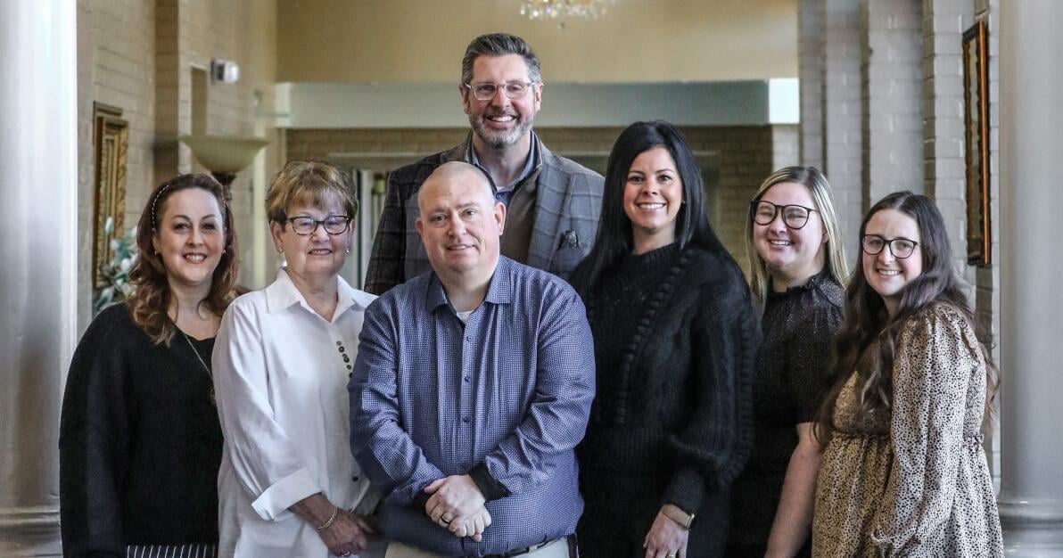 Morris leading Haley McGinnis with mostly women funeral director staff