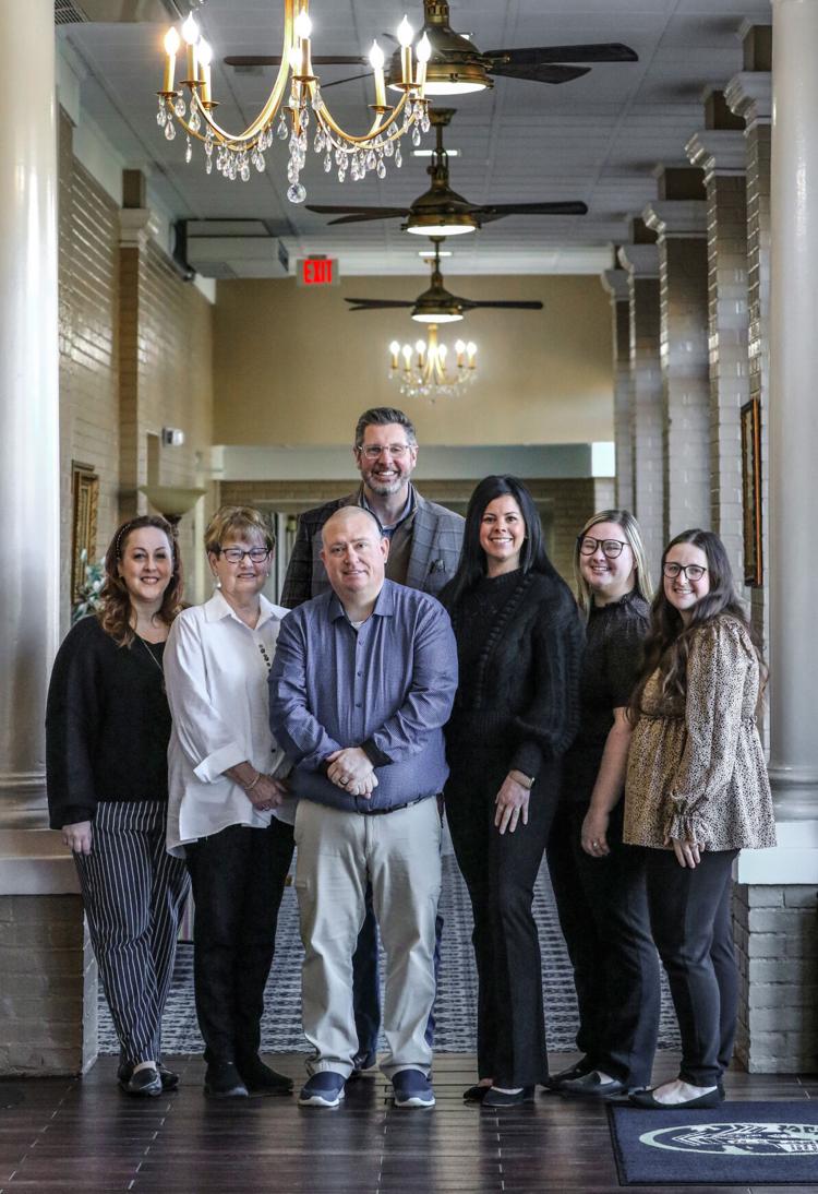 Morris leading Haley McGinnis with mostly women funeral director staff