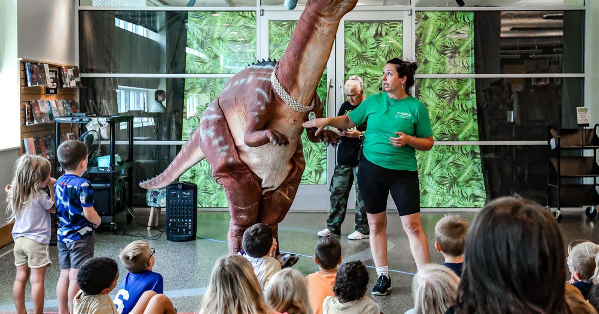 Pre-historic Encounter: Dinosaur program draws large crowd to library ...