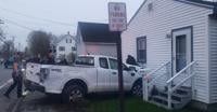 A house at 108 Main St. was damaged when a pickup truck struck it.
