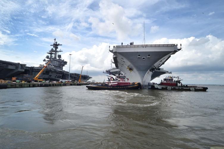The aircraft carrier USS George Washington (CVN 73) gets underway in ...