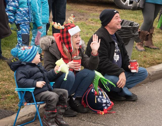 Thousands join Santa along parade route to kick off Christmas season in