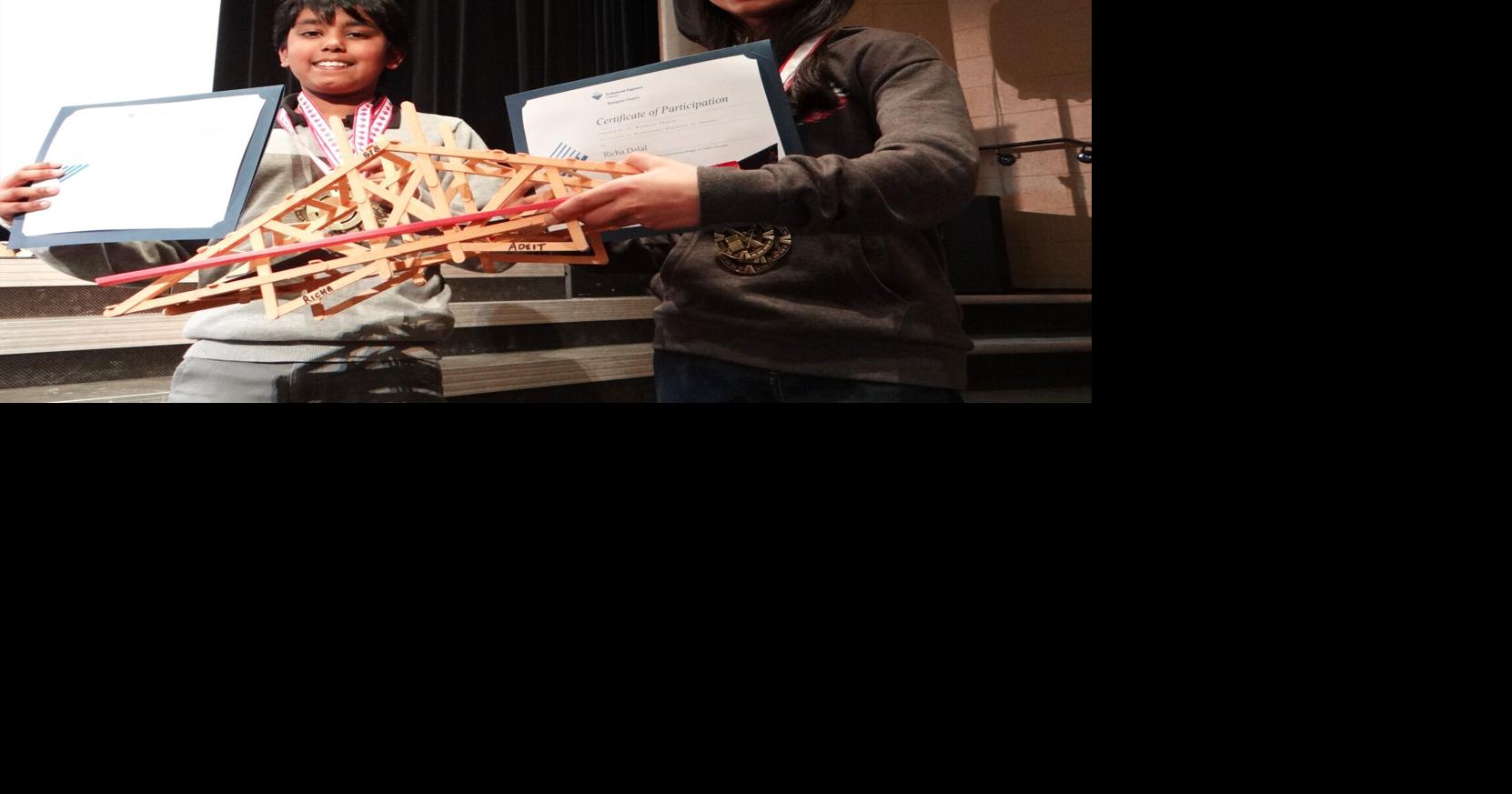 Popsicle stick bridge building contest introduces students to the world of engineering