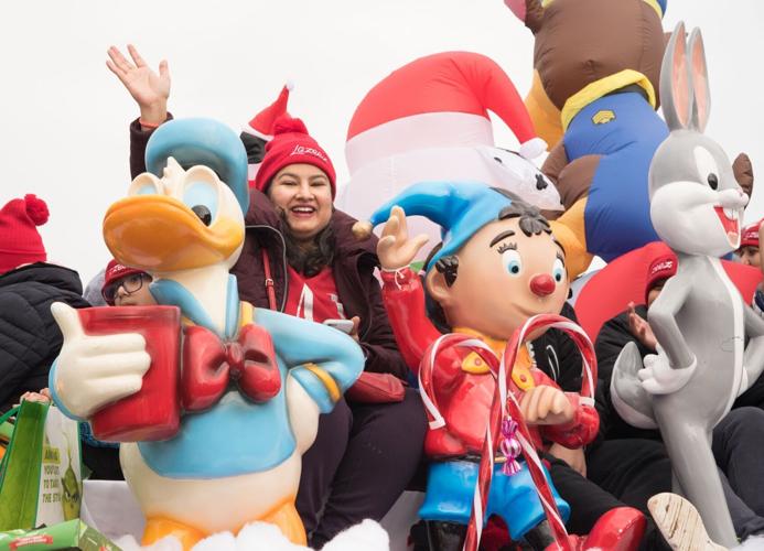 Thousands join Santa along parade route to kick off Christmas season in