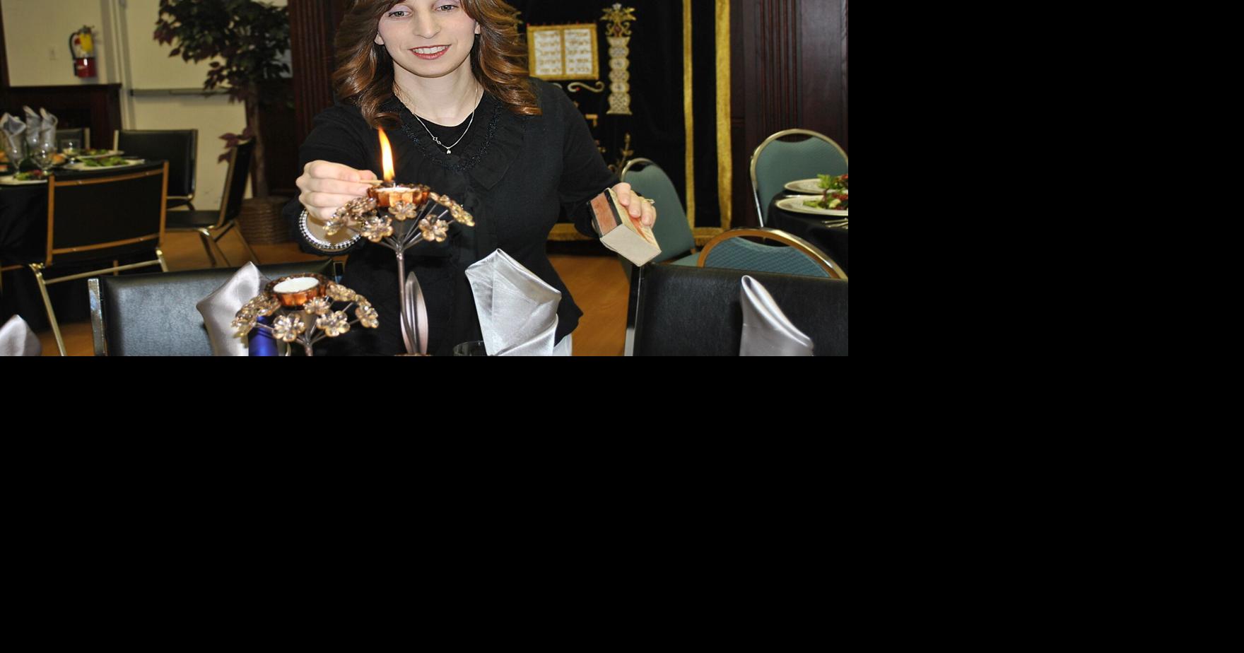 Chabad Jewish Discovery Centre holding menorah lighting