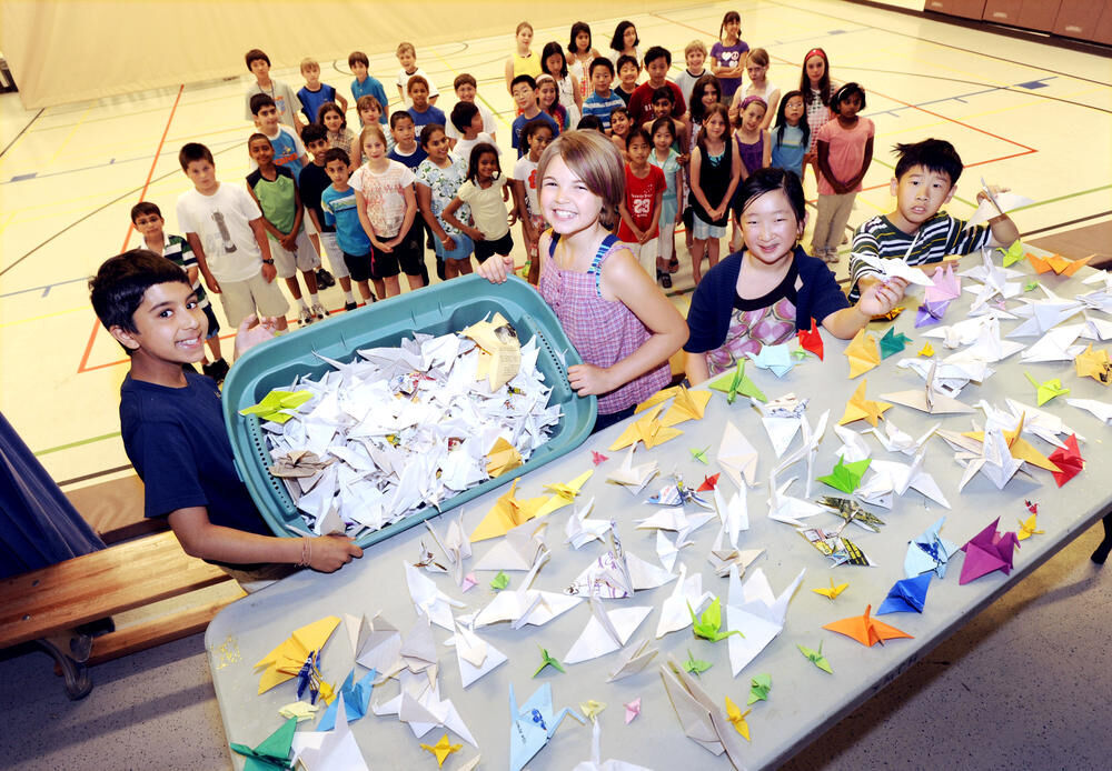 Students fold paper cranes