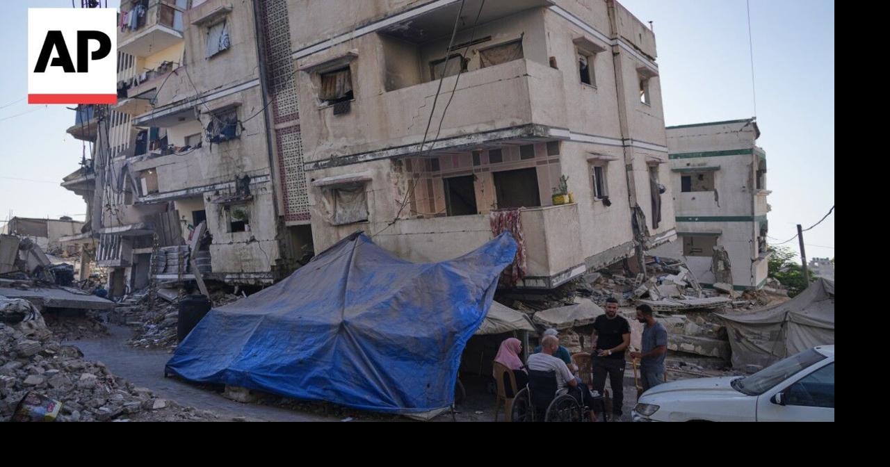 Gaza residents move back into their homes despite the risk of buildings collapsing