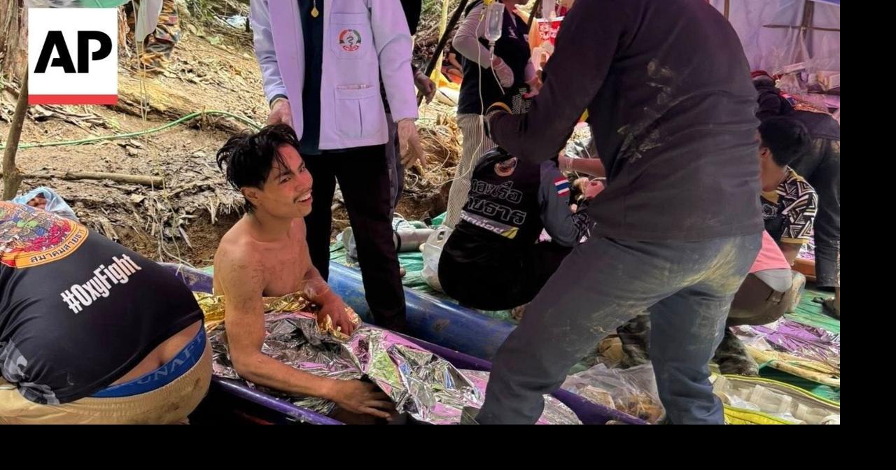 Rescue diver reacts to trapped villagers emerging from flooded Laos cave