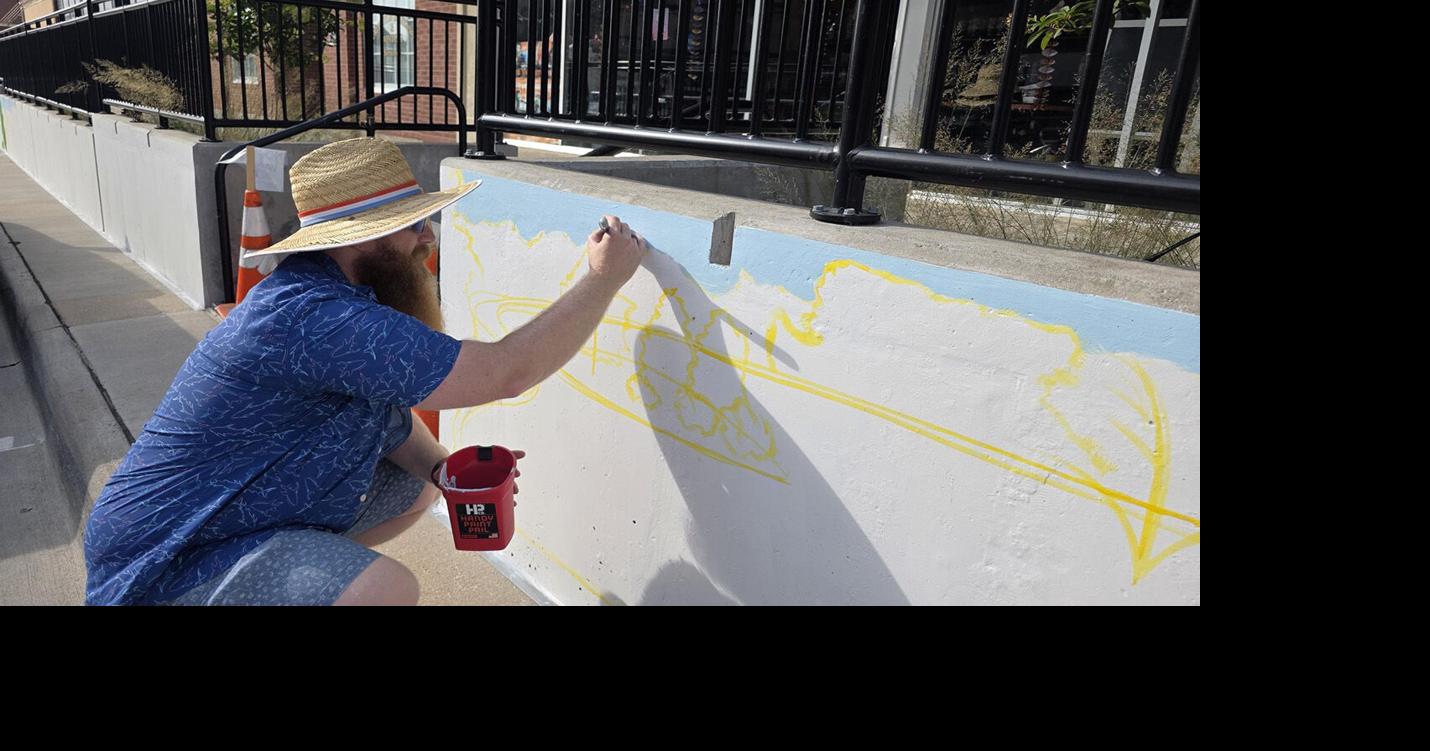 Local Art Teacher Paints Leopold Legacy Mural in Downtown Burlington