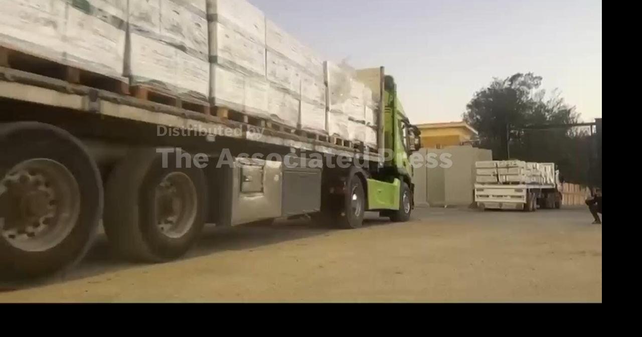 Trucks full of aid supplies go through Rafah Gate to be inspected at Kerem Shalom crossing