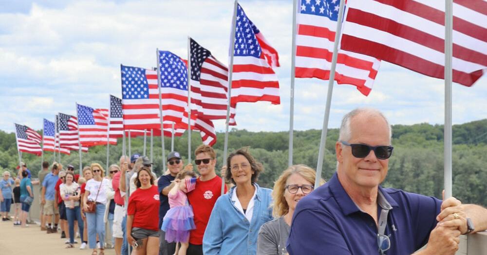 Flags Over the Mississippi: A Sea of Red, White and Blue Honors Country, Community and Those Who Came Before