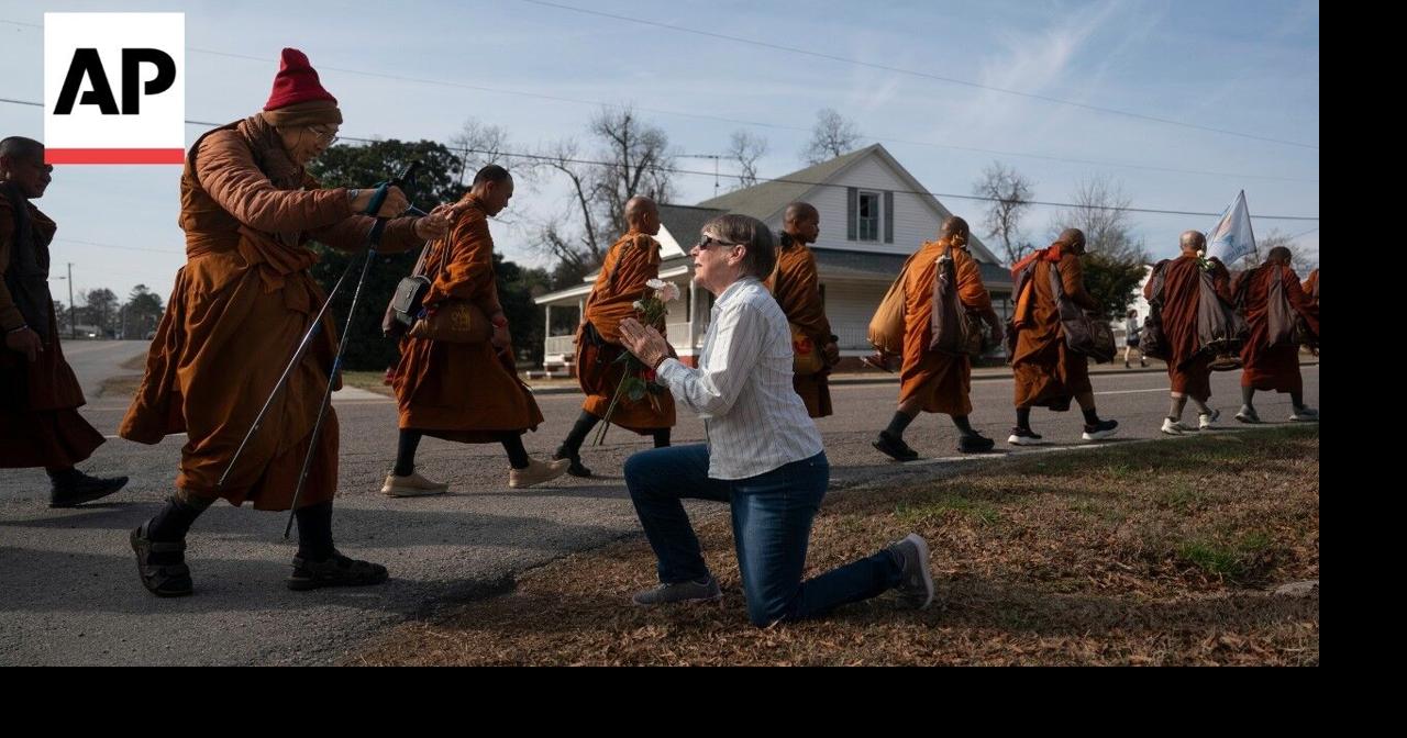 Buddhist monks and their dog captivate Americans while on peace walk