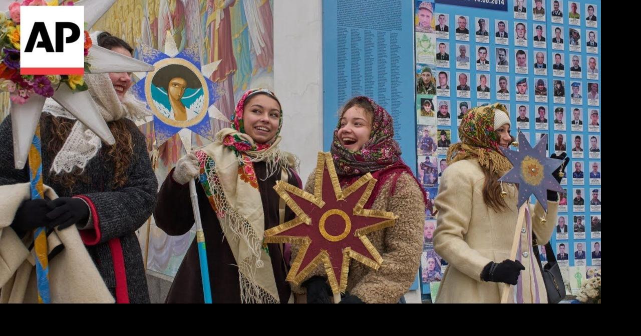 Ukrainians sing carols during Christmas parade in Kyiv as air alarm sounds