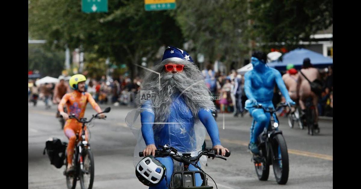 Under clouds and drizzle, Seattle naked bike riders welcome summer solstice