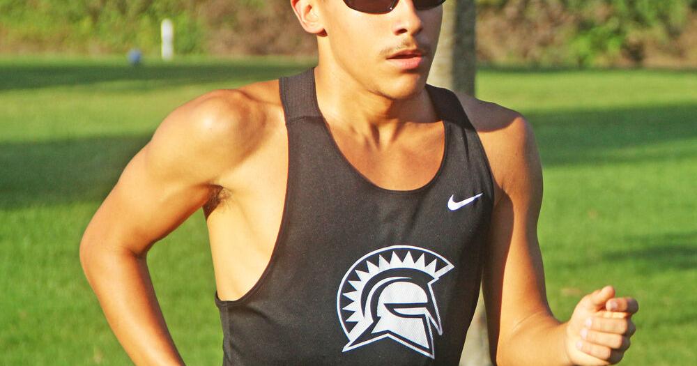 Titans boys cross country runners compete in the 2026 Charger Invite