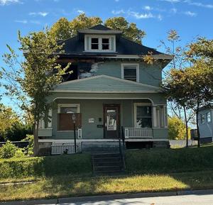Mixed fates for two fire-damaged houses