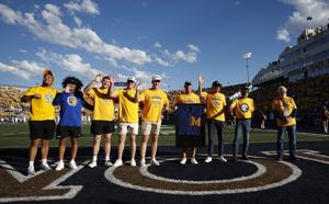 Former national champions pass letter sweater prior to Bobcats' Gold Rush win