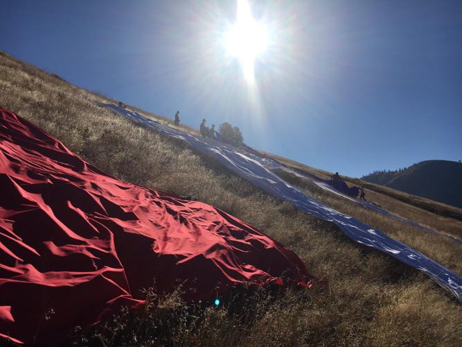 Protesters spell out "LIAR" on Mount Jumbo
