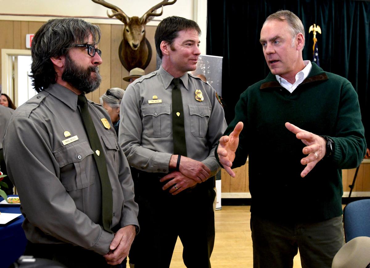 U.S. Interior Secretary Ryan Zinke talks with Park Service employees