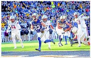 Sentinel grad leads big group competing for carries