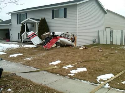 kalispell house crash removed ntsb airplane cause looks plane missoulian seaman crashed scene into family after