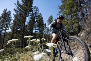 More than 400 cyclists show off grit in 20th year of Butte 100 mountain bike race