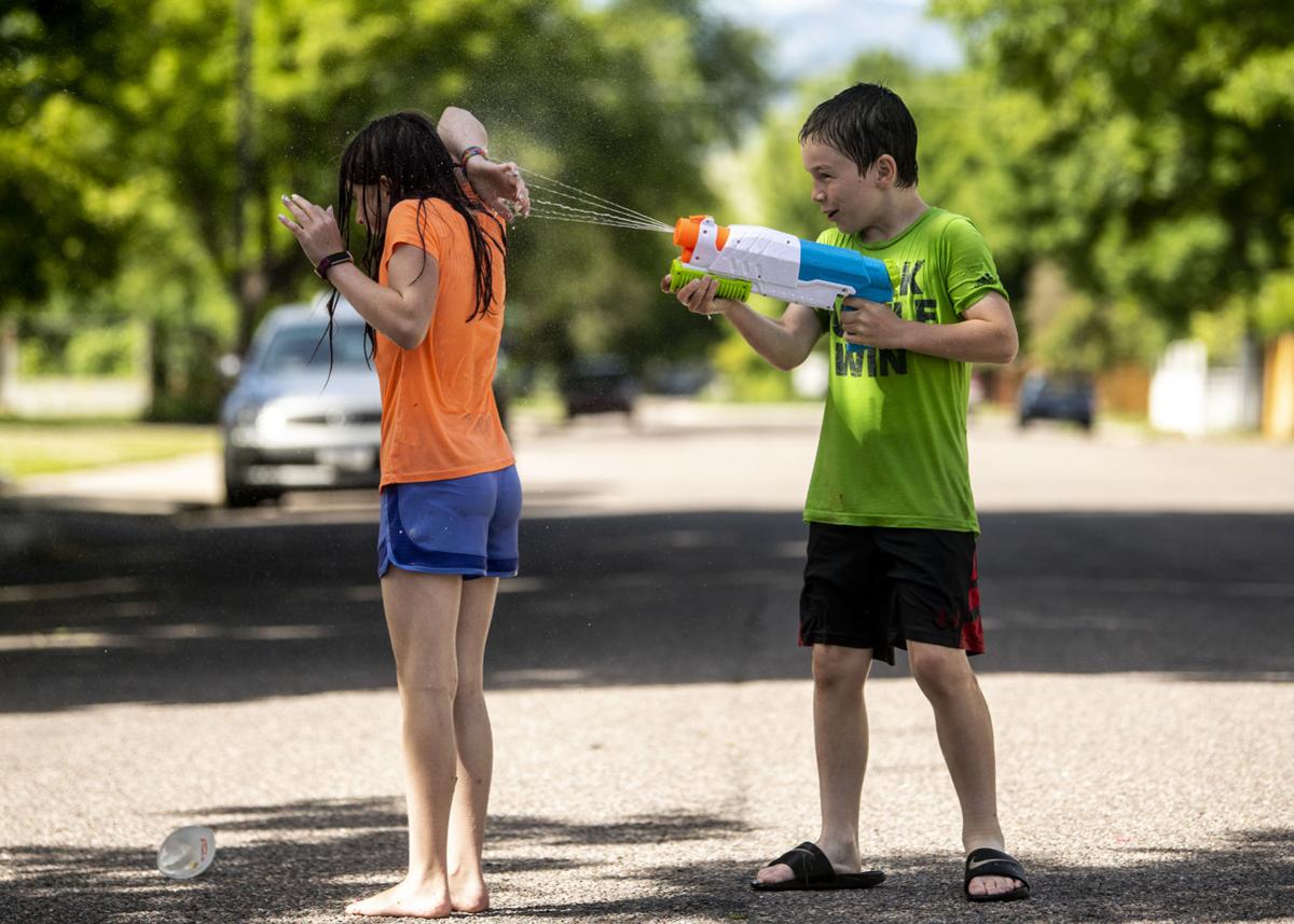 Photos Missoula neighborhood kids stay cool with squirt gun fight