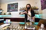 Theresa Upp, manager at Gallatin Valley Organics, weighs out some marijuana buds