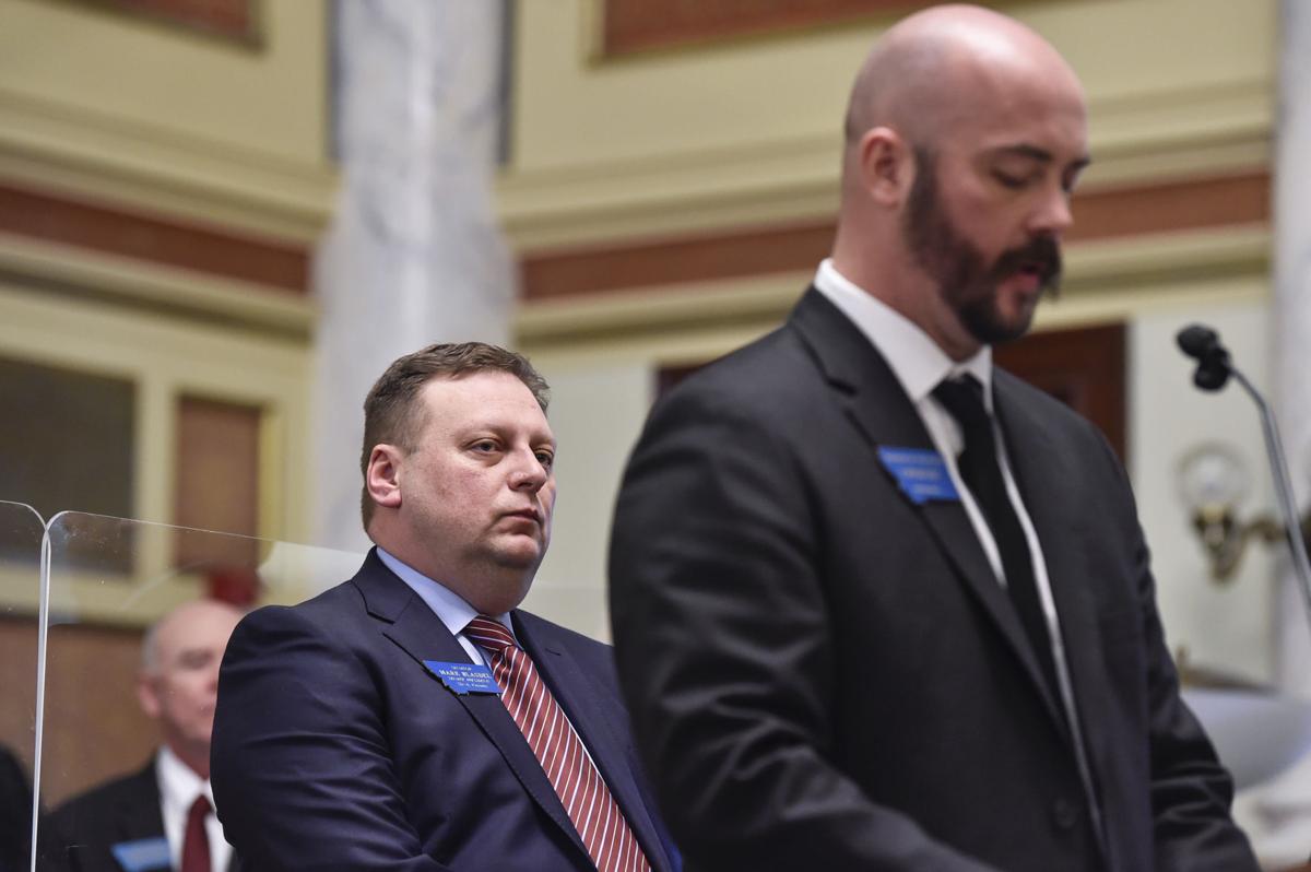 Senate President Mark Blasdel, R-Kalispell, left, watches