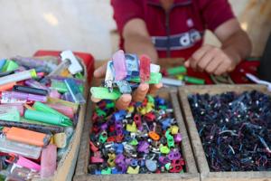 In Gaza's tent camps, cigarette lighters became a lifeline