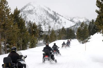 A group of snowmobilers