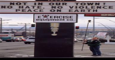 Rick Smith put up Not In Our Town sign at Universal Athletic - Vimarsana News