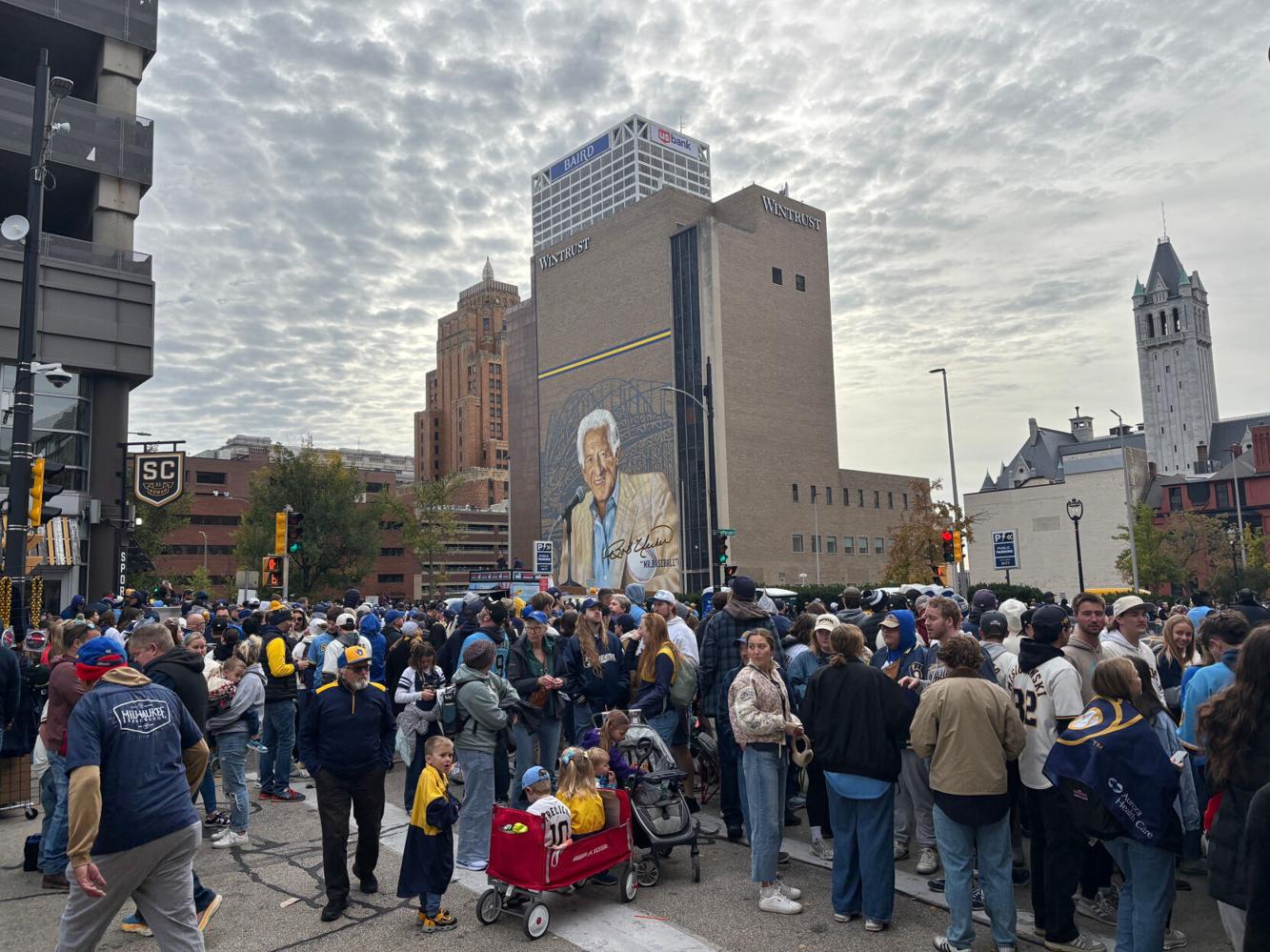 People set up around the Bob Uecker mural for the Milwaukee Brewers ...