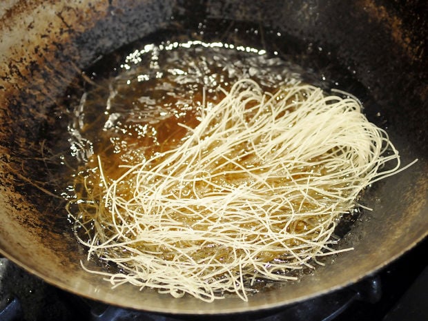 Puffed rice stick noodles add crunch to Chinese chicken salad