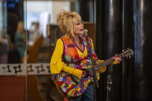Notable people react to the death of country singer Dolly Parton
